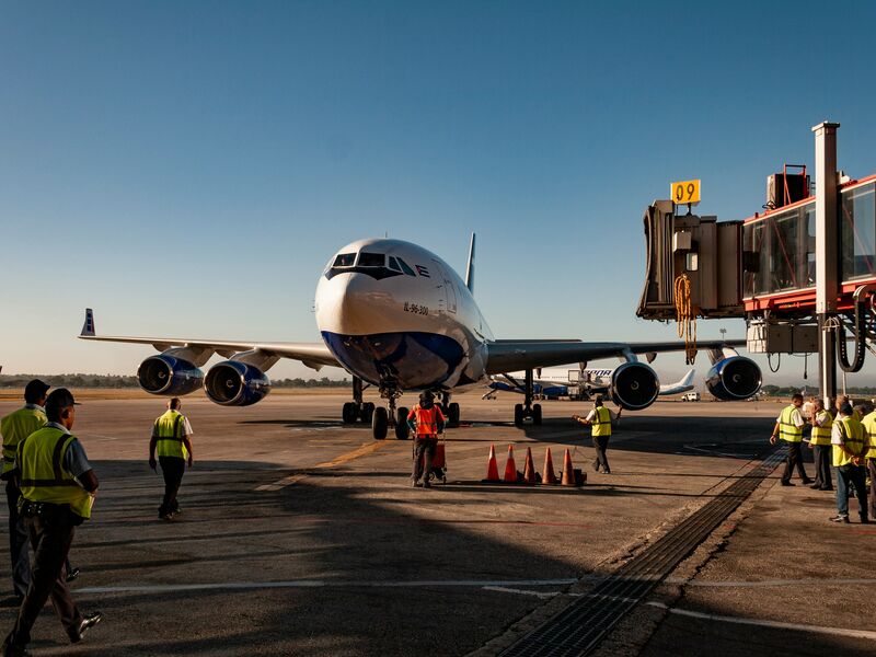 Ground crew servicing aircraft on the ramp